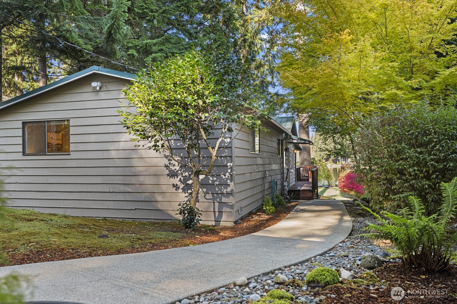 7727 Lake Alice Road Southeast Fall City, WA 98024 - Photo 22 of 34 a backyard of a house with outdoor seating