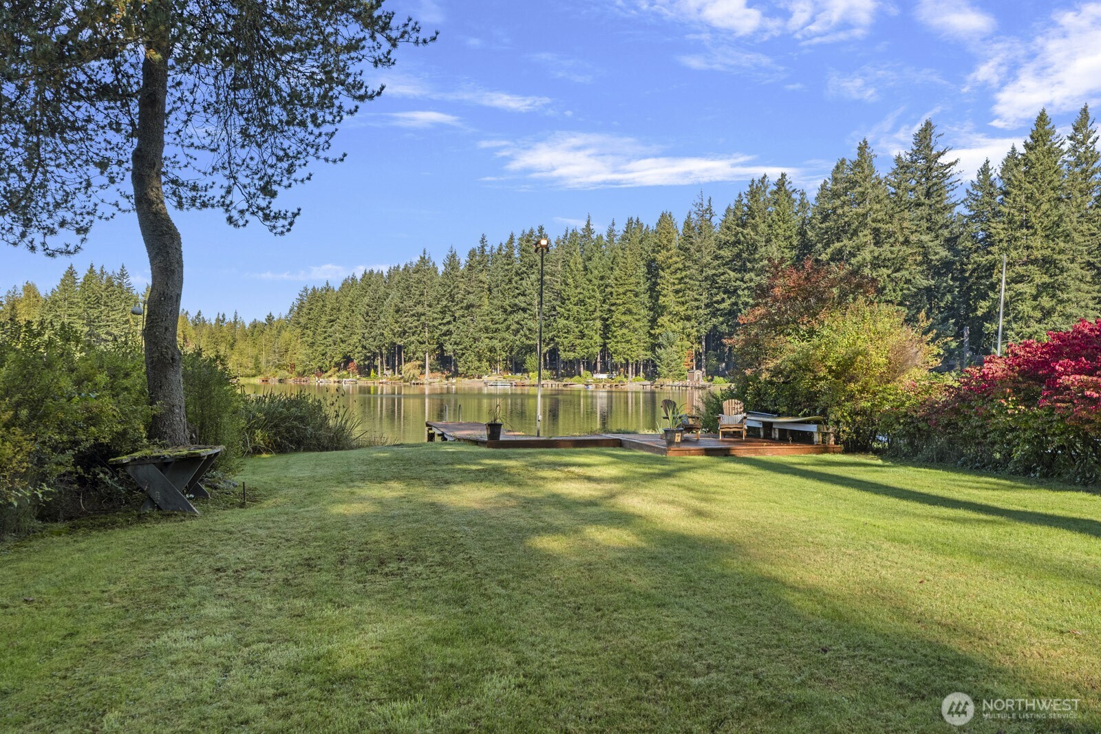 7727 Lake Alice Road Southeast Fall City, WA 98024 - Photo 26 of 34 a view of a house with a big yard and potted plants and large trees