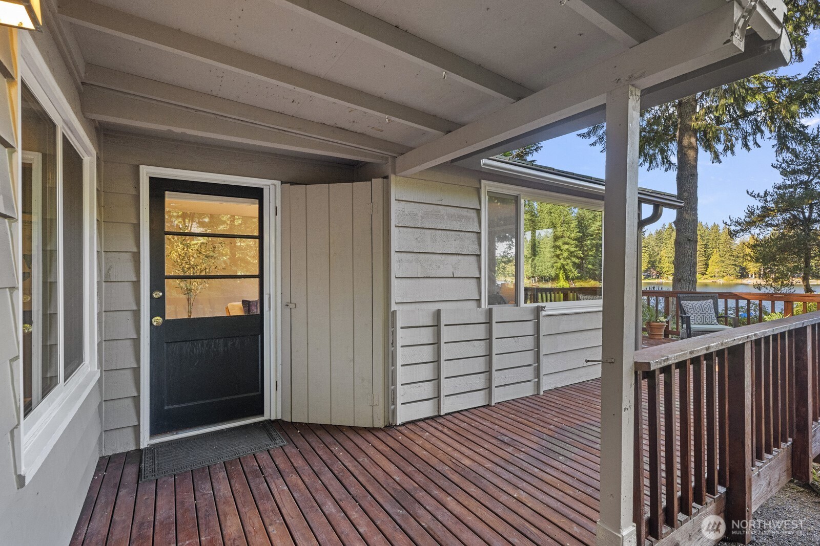 7727 Lake Alice Road Southeast Fall City, WA 98024 - Photo 4 of 34 a view of a porch with wooden floor and outdoor space