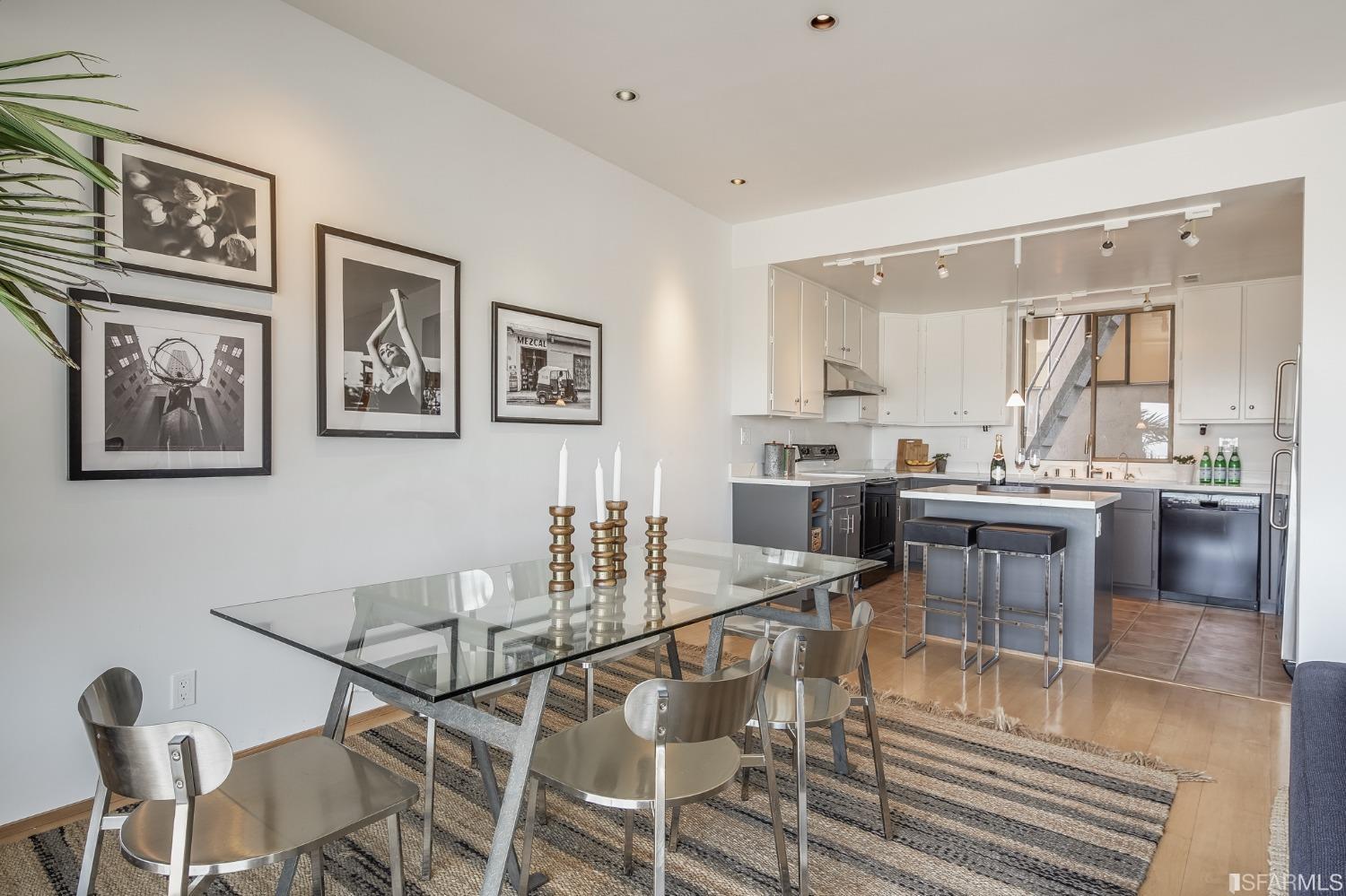 138 Corwin Street San Francisco, CA 94114 - Photo 18 of 60 a kitchen with stainless steel appliances kitchen island granite countertop a dining table and chairs