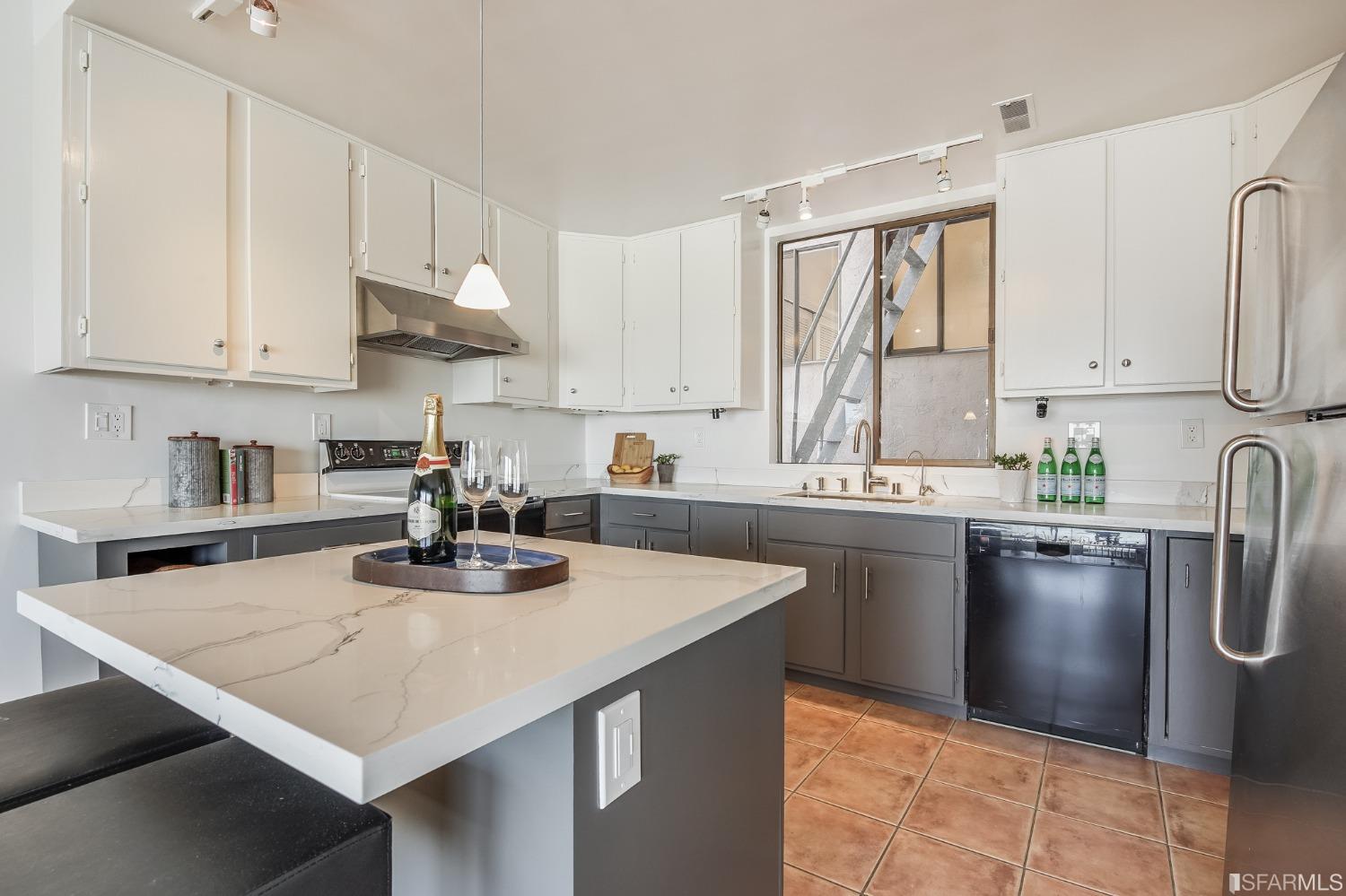 138 Corwin Street San Francisco, CA 94114 - Photo 20 of 60 a kitchen with stainless steel appliances granite countertop a sink a stove and white cabinets