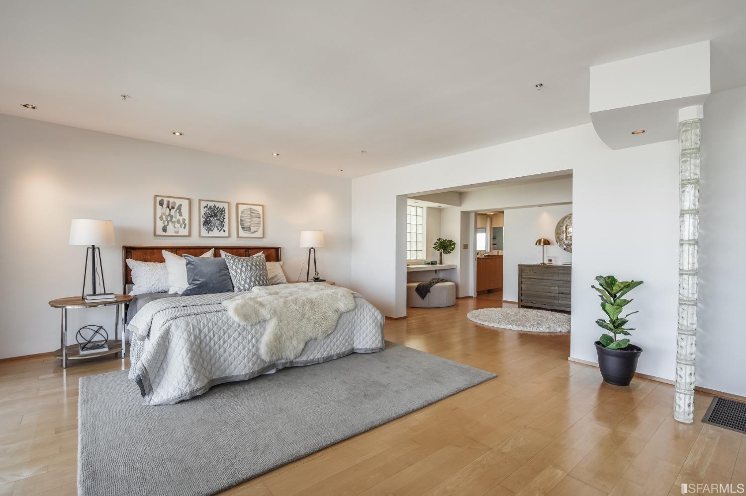 138 Corwin Street San Francisco, CA 94114 - Photo 24 of 60 a spacious bedroom with a bed and a couch