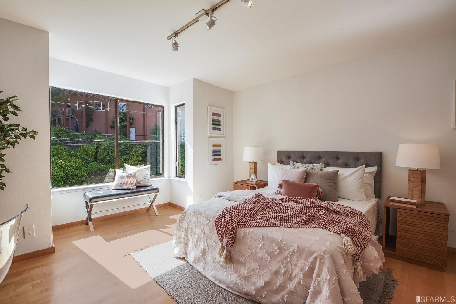 138 Corwin Street San Francisco, CA 94114 - Photo 29 of 60 a bed room with a bed and a chair