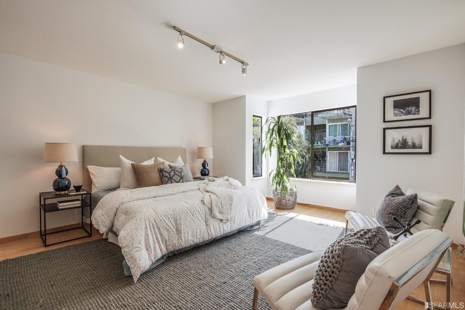 138 Corwin Street San Francisco, CA 94114 - Photo 31 of 60 a bed room with a bed and a couch