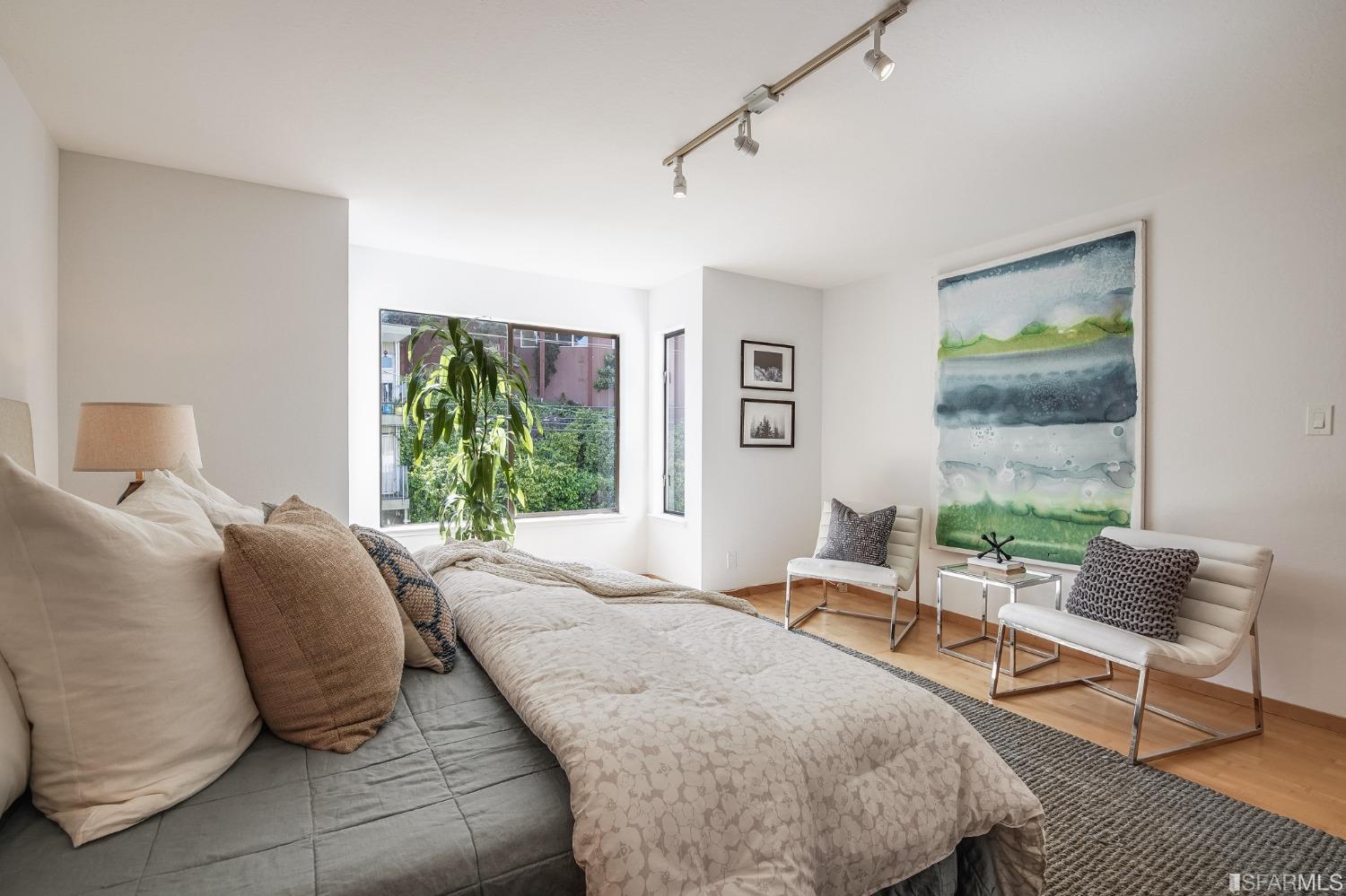 138 Corwin Street San Francisco, CA 94114 - Photo 32 of 60 a bedroom with a bed and large window