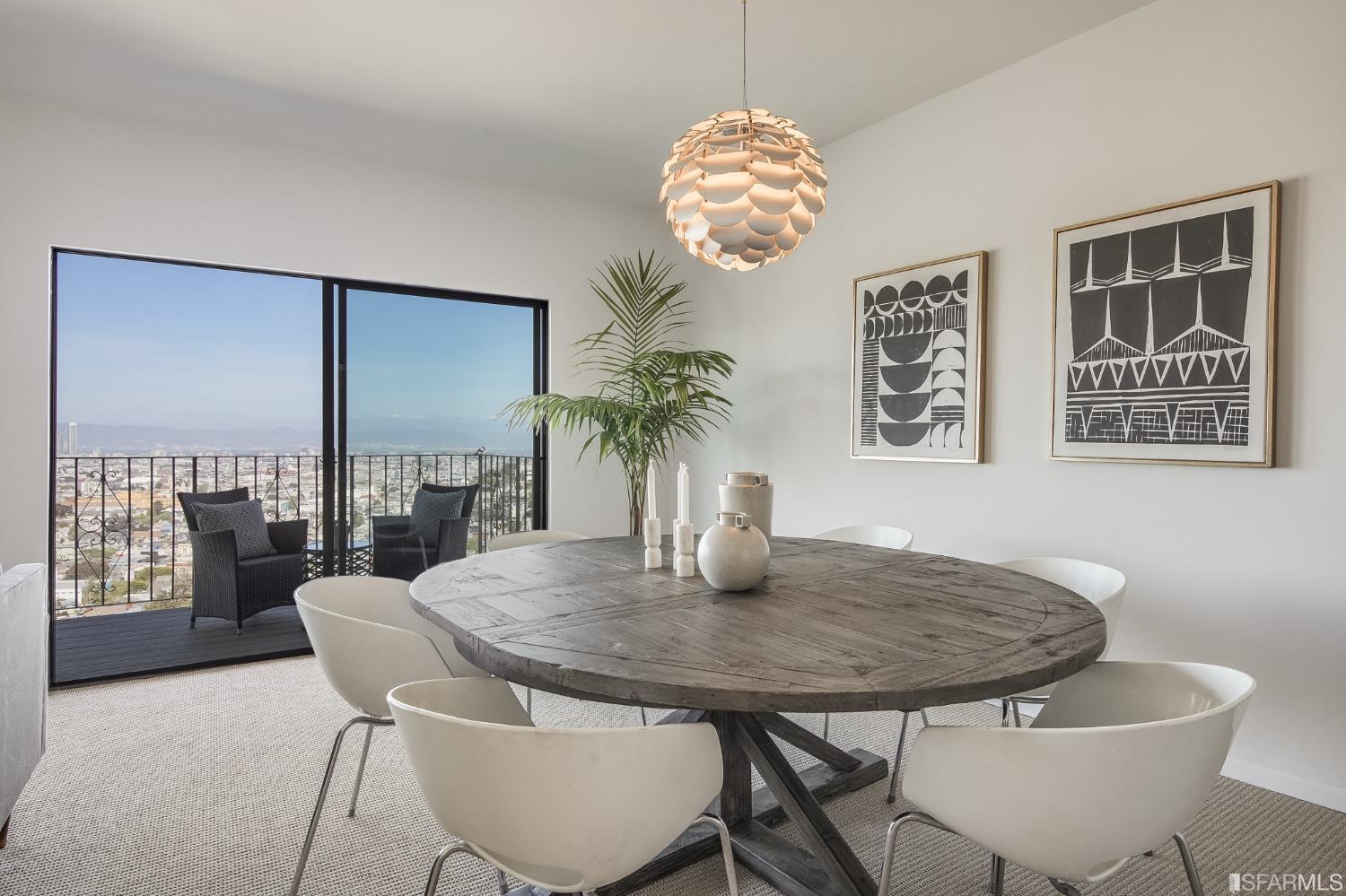 138 Corwin Street San Francisco, CA 94114 - Photo 38 of 60 a dining room with furniture a rug and a chandelier
