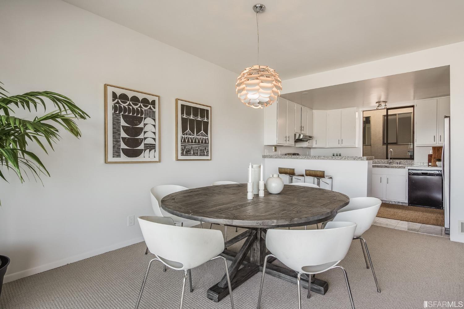 138 Corwin Street San Francisco, CA 94114 - Photo 41 of 60 a view of a dining room with furniture a chandelier and wooden floor