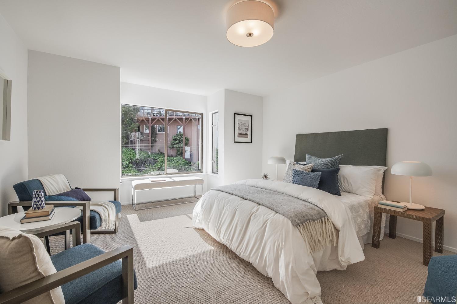 138 Corwin Street San Francisco, CA 94114 - Photo 44 of 60 a bedroom with a bed and a couch