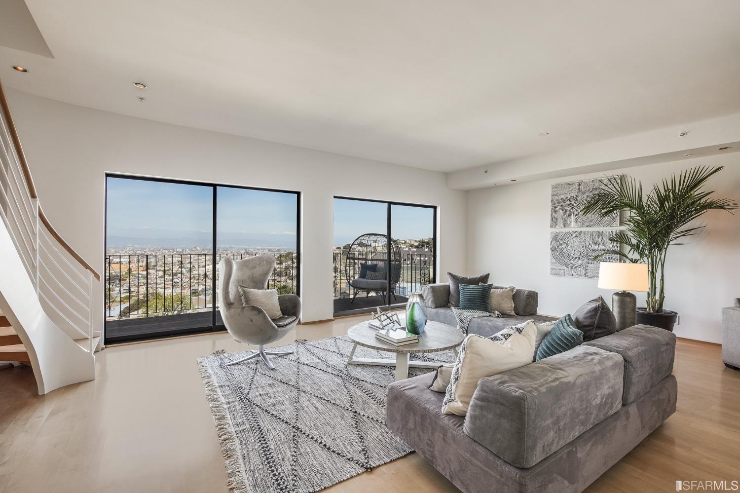 138 Corwin Street San Francisco, CA 94114 - Photo 8 of 60 a living room with furniture floor to ceiling window and a potted plant