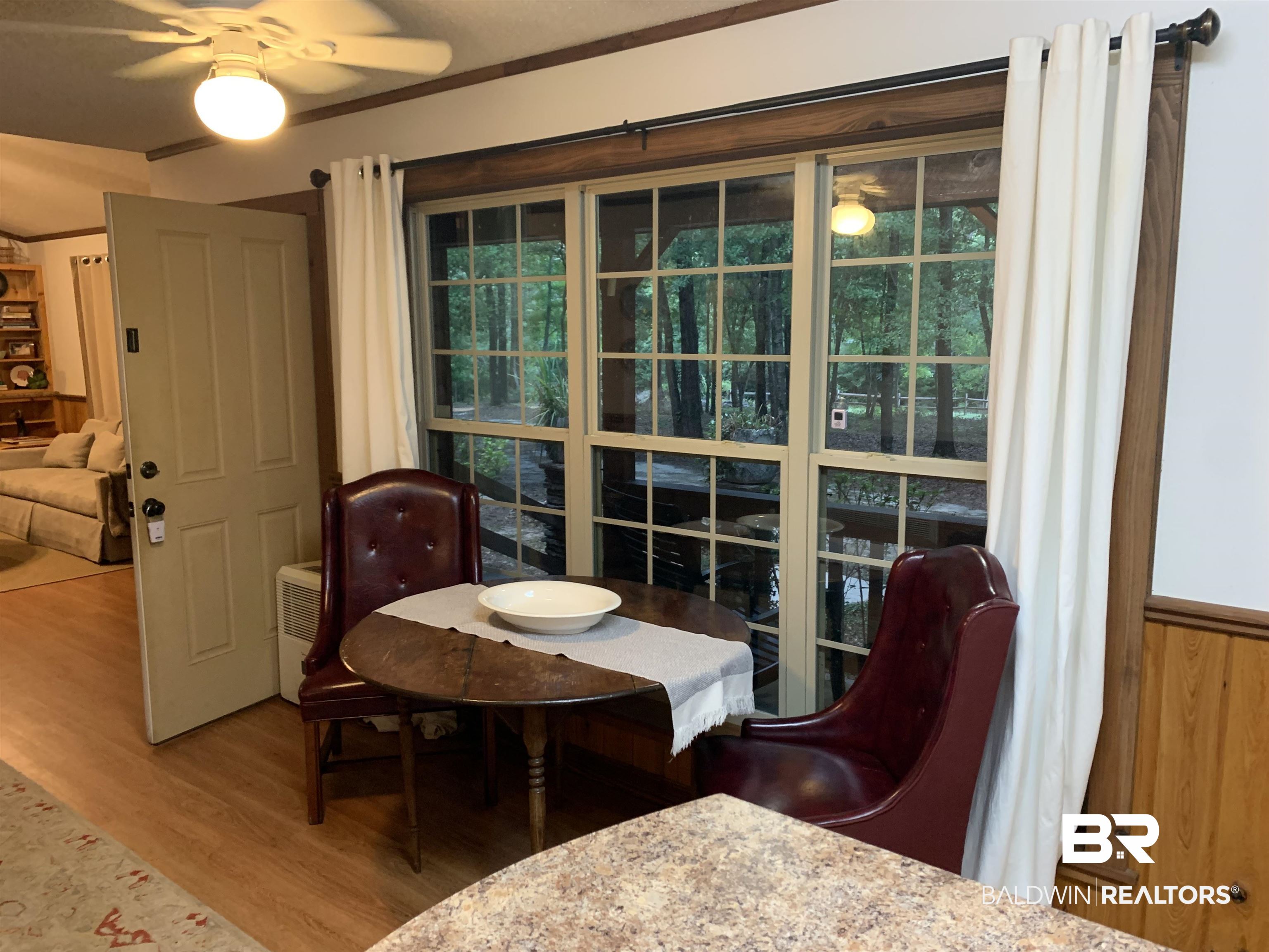 465 Rock Creek Road Wing, AL 36483 - Photo 4 of 15 Dining area featuring ceiling fan and hardwood / wood-style floors