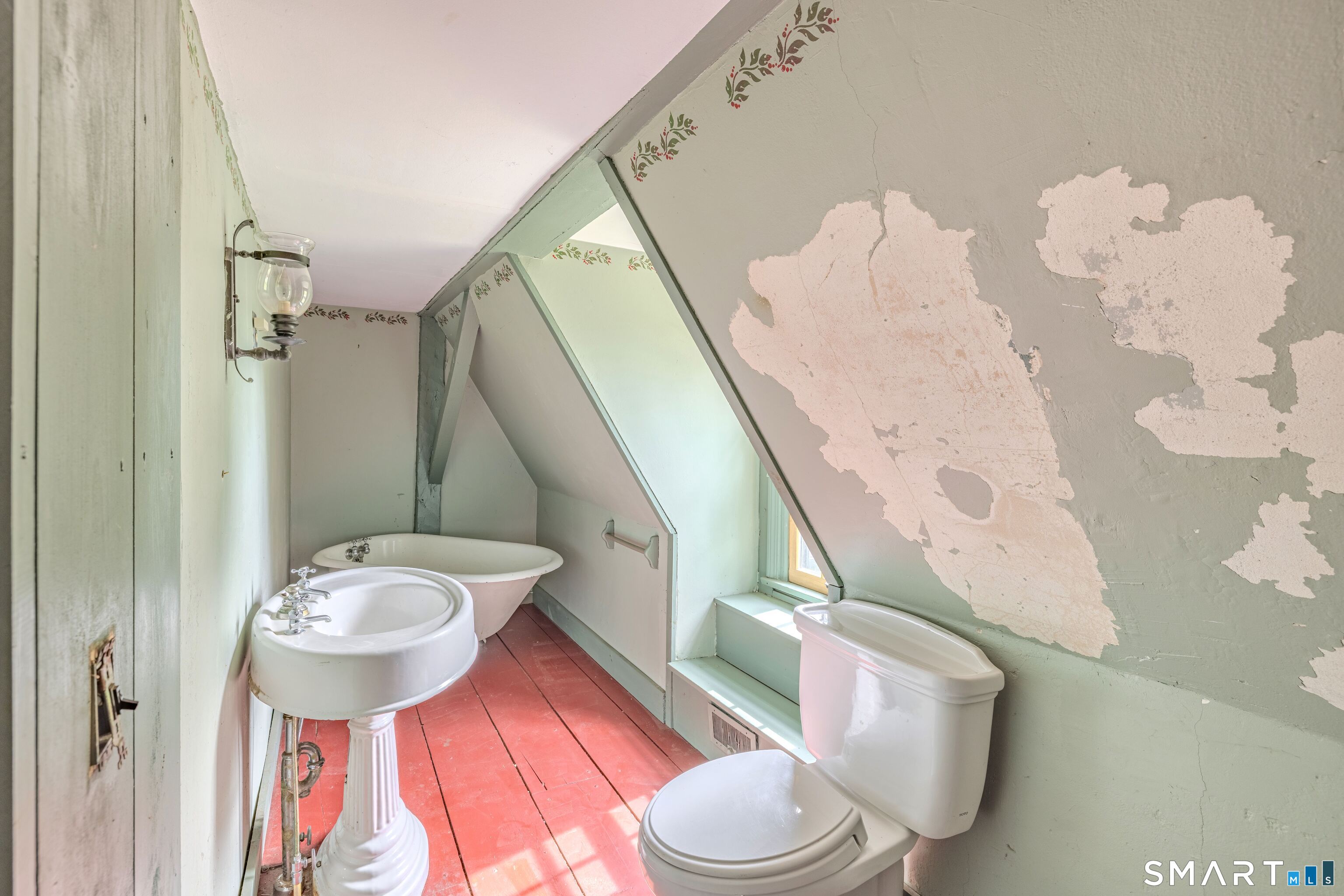 261 Hebron Road Bolton, CT 06043 - Photo 24 of 40 a bathroom with a sink mirror and toilet