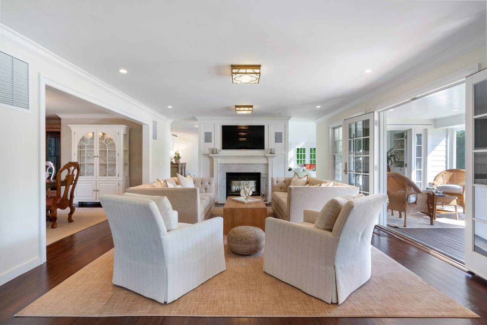 91 Osprey Way Water Mill, NY 11976 - Photo 13 of 46 a living room with furniture a flat screen tv and a fireplace