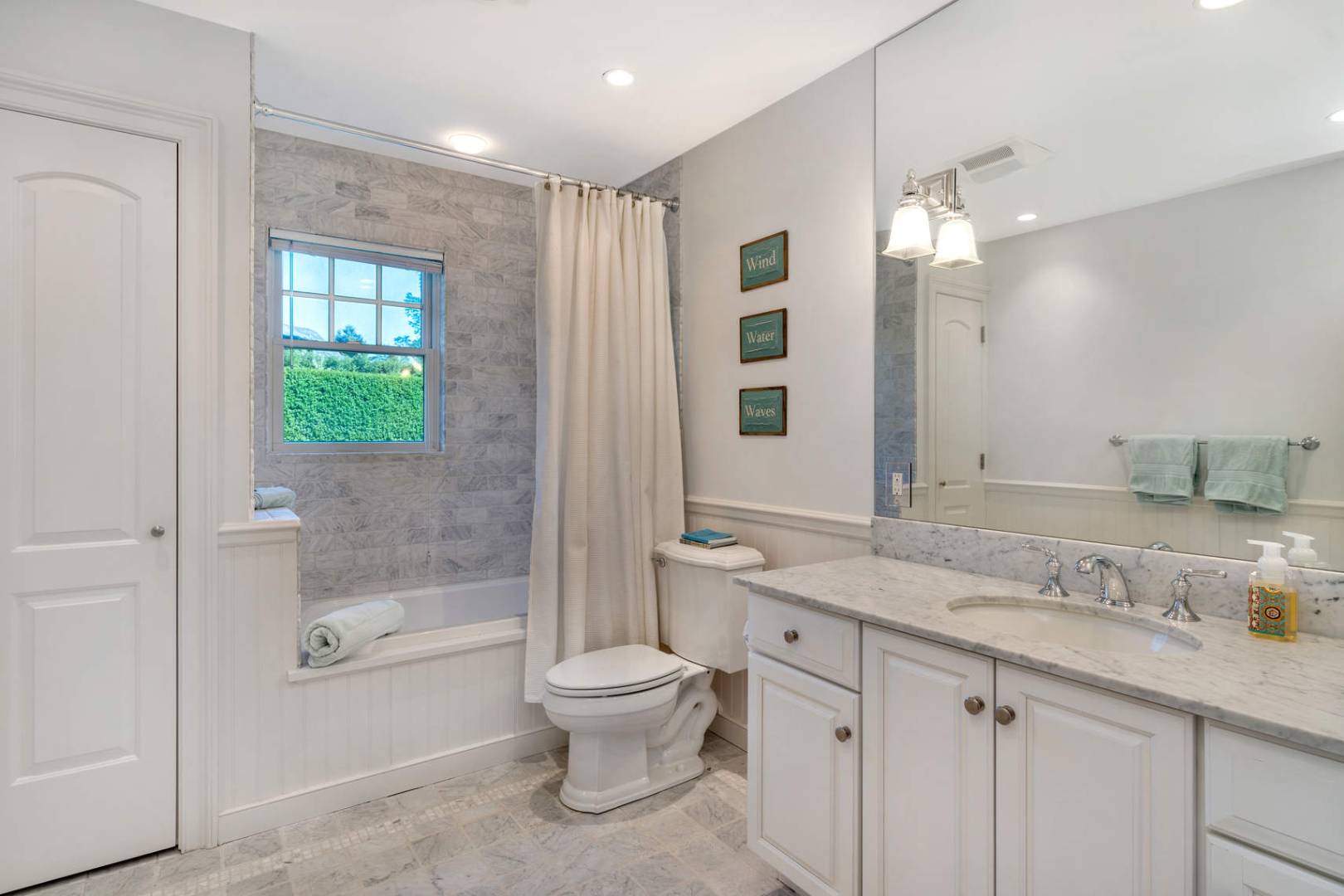 91 Osprey Way Water Mill, NY 11976 - Photo 20 of 46 a bathroom with a granite countertop sink a toilet and shower