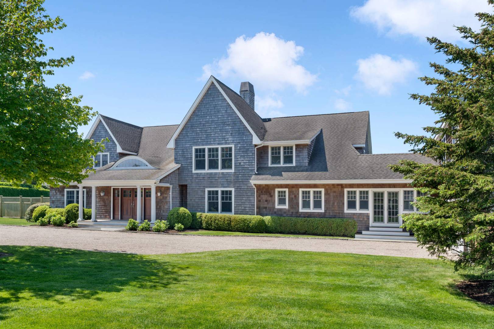 91 Osprey Way Water Mill, NY 11976 - Photo 3 of 46 a front view of a house with a garden