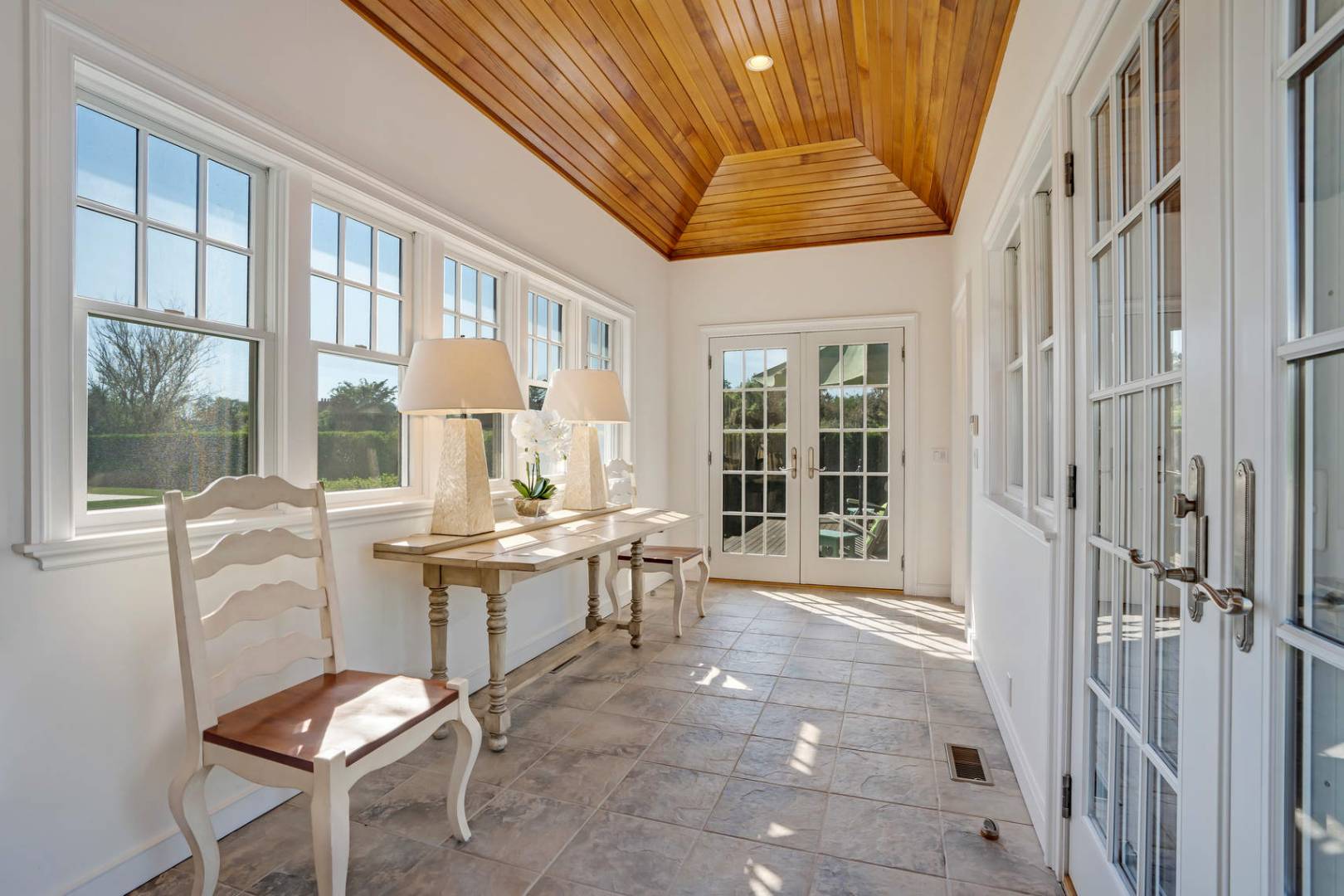 91 Osprey Way Water Mill, NY 11976 - Photo 24 of 46 a view of a dining room with furniture window and outside view