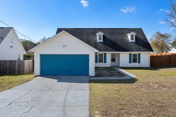 a front view of a house with a yard