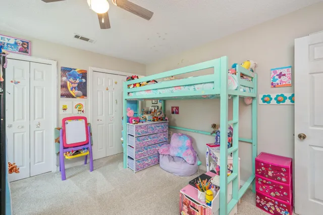 a bedroom with toys and a bed