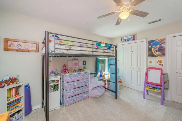 a bed room with a bed and a baby bed