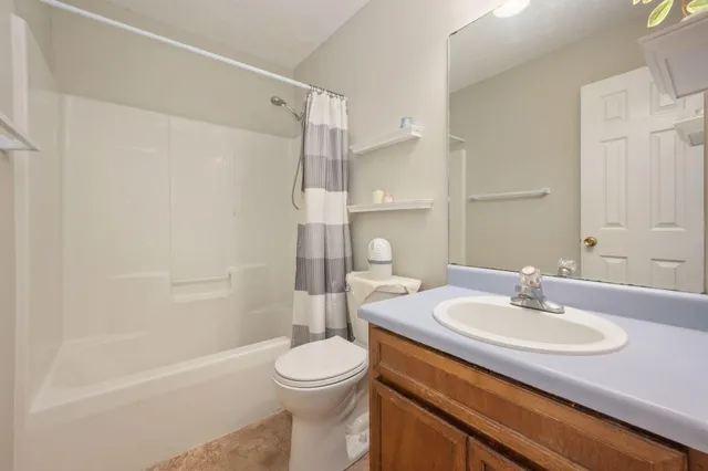 a bathroom with a sink a toilet and a bathtub