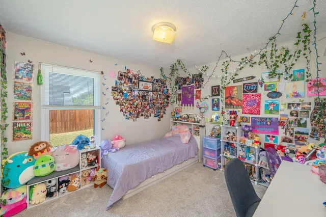 a living room with lots of baby toys