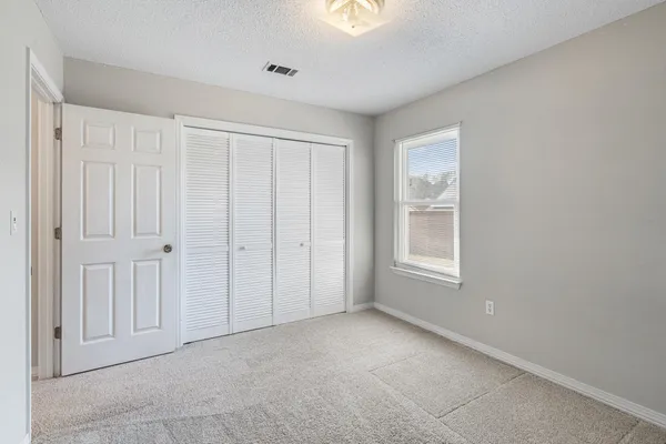 a bathroom with a tub shower and a sink