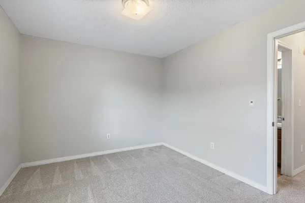 a bathroom with a tub sink shower and mirror