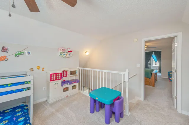 a room with furniture and a flat screen tv