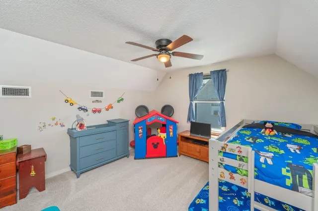 a room with furniture and a flat screen tv