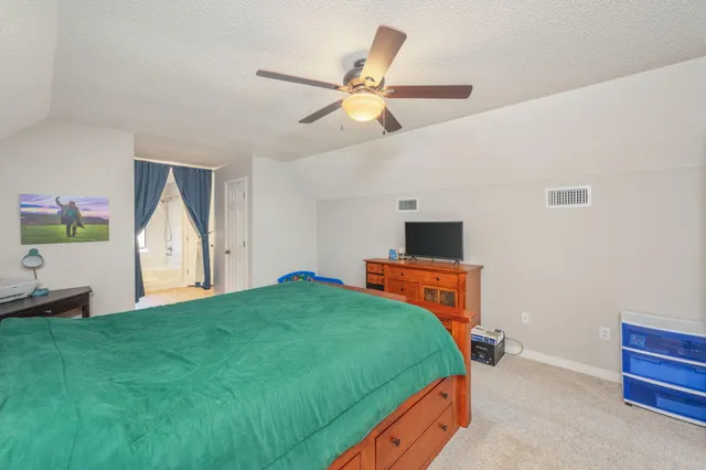 a view of entryway with wooden floor and livingroom