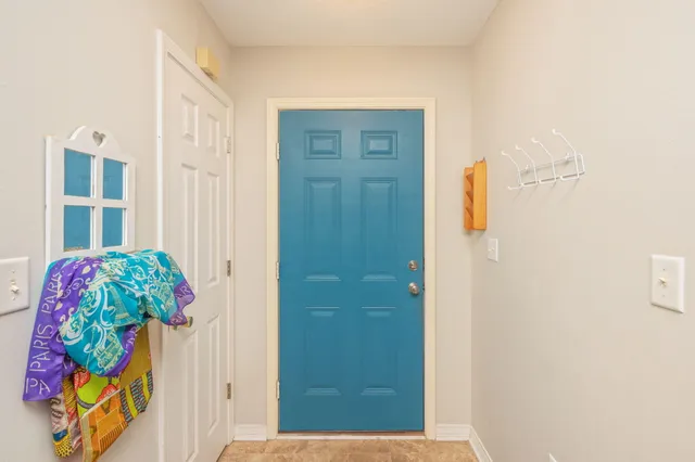 a living room with furniture and a ceiling fan