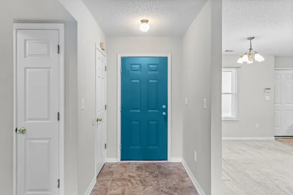 a kitchen with stainless steel appliances granite countertop a stove top oven a sink dishwasher a refrigerator and a microwave