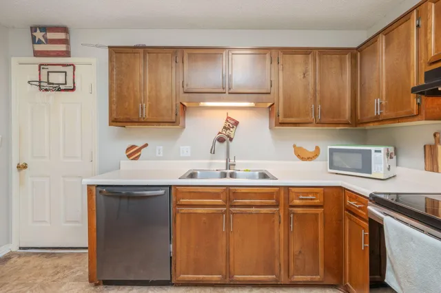 a room with furniture a washer and dryer
