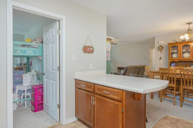 a room with furniture a washer and dryer