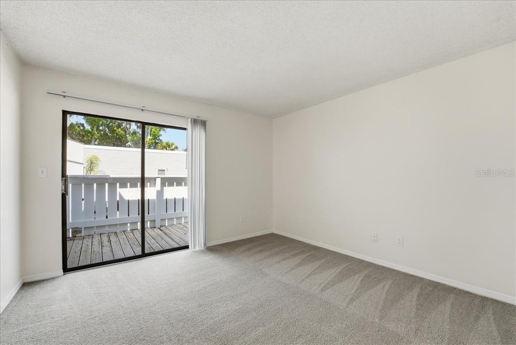 1428 Oak Place, Unit C Apopka, FL 32712 - Photo 10 of 16 an empty room with windows