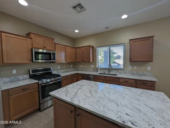 a kitchen with a stove and a sink