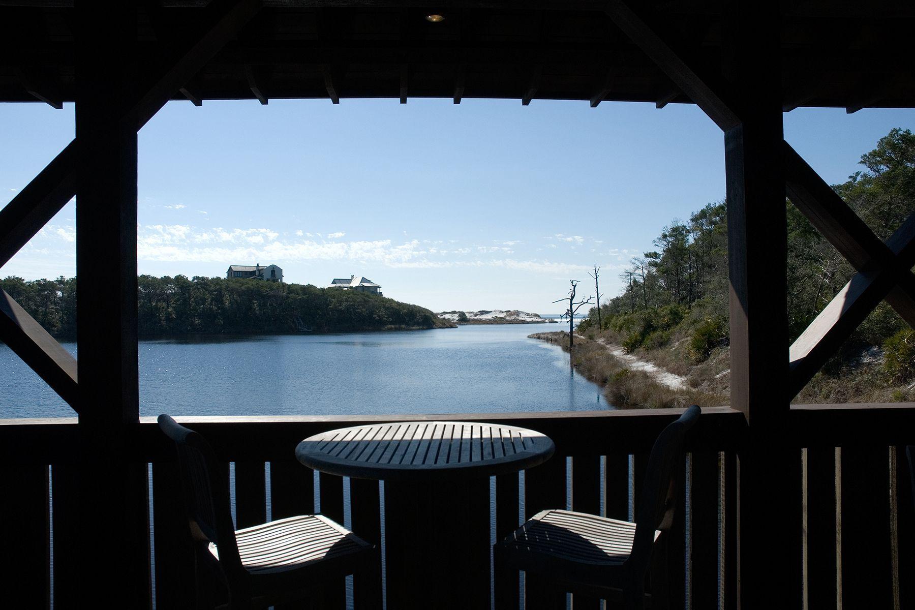 4-8 Cedar Post Road Santa Rosa Beach, FL 32459 - Photo 8 of 12 a view of balcony with wooden floor and outdoor seating