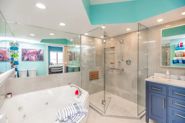 a bathroom with a tub sink and shower