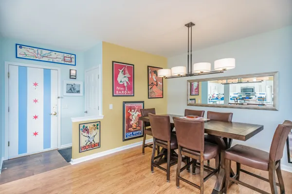 a dining room with furniture and window