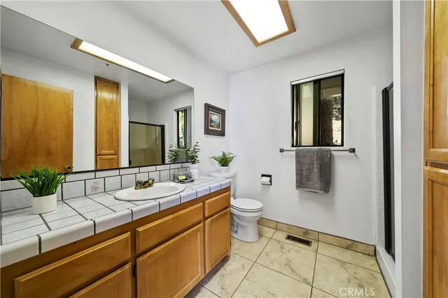 a view of a city with lush green forest