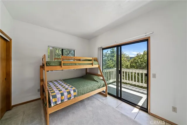a bathroom with a granite countertop sink mirror and toilet