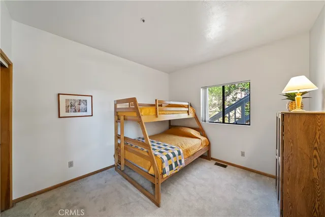 a view of balcony with wooden floor and fence