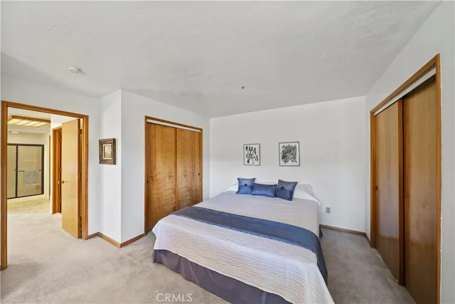 a bed room with a bed and a fireplace