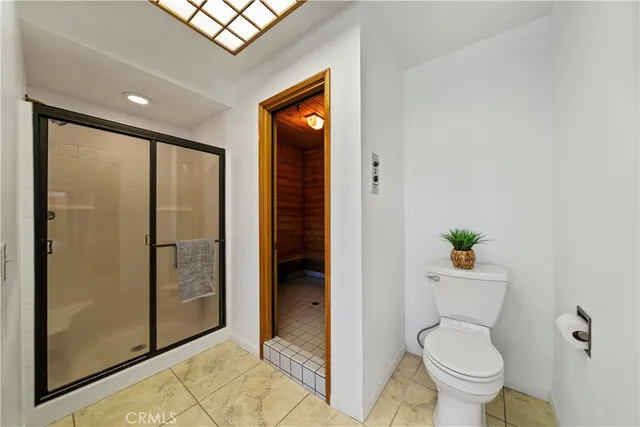 a bathroom with a sink a mirror and a shower