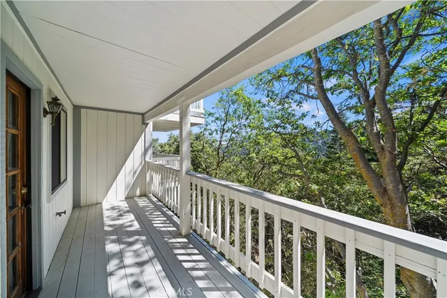 a view of a balcony with wooden floor