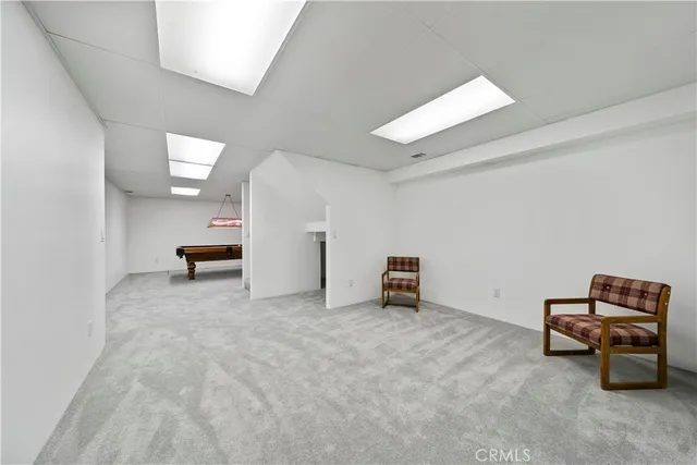 a view of work space with furniture and window