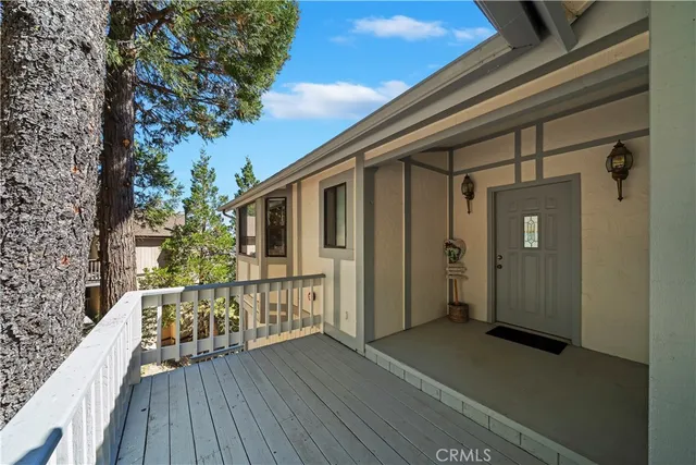 a view of a house with wooden deck