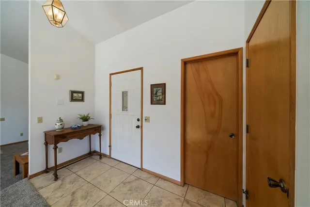 a view of a hallway to rooms