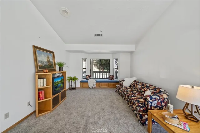 a bed room with furniture and a window