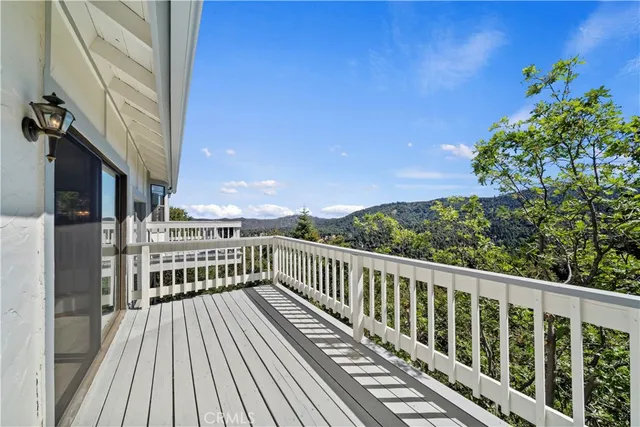 a view of balcony with wooden floor