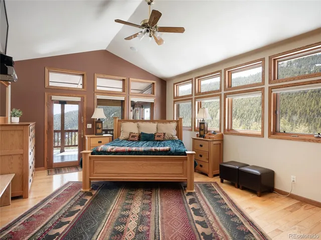 a bedroom with furniture and a window